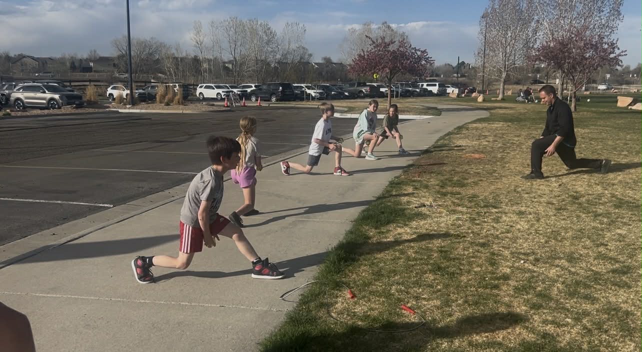 Brandon coaching young athletes